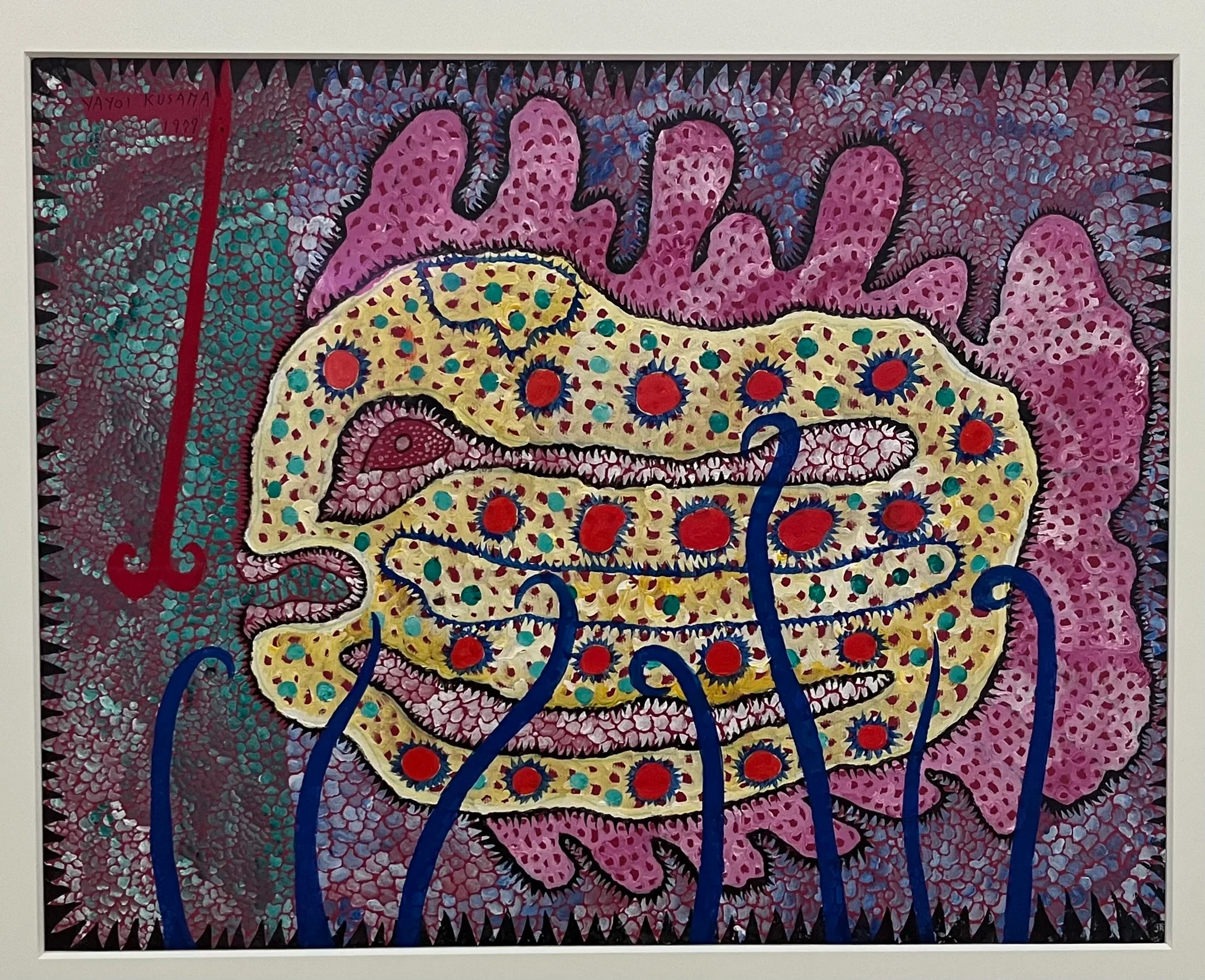 Une peinture abstraite représentant une grande forme jaune et rose avec des détails rouges et bleus, ressemblant à une créature marine stylisée. L'arrière-plan est composé de motifs vibrants dans des tons bleu sarcelle et violet, rehaussant l'esthétique colorée et fantaisiste de l'ensemble.
An abstract painting featuring a large, yellow and pink form with red and blue detailing, resembling a stylized fish creature. The background consists of vibrant patterns in shades of teal and purple, enhancing the overall colorful and whimsical aesthetic. Une peinture abstraite représentant une grande forme jaune et rose avec des détails rouges et bleus, ressemblant à une créature marine stylisée. L'arrière-plan est composé de motifs vibrants dans des tons bleu sarcelle et violet, rehaussant l'esthétique colorée et fantaisiste de l'ensemble.
An abstract painting featuring a large, yellow and pink form with red and blue detailing, resembling a stylized fish creature. The background consists of vibrant patterns in shades of teal and purple, enhancing the overall colorful and whimsical aesthetic.